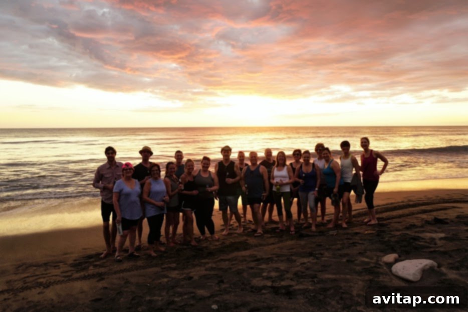 A serene group of people enjoying the beautiful beach at sunset in Nicaragua, perfect for a peaceful yoga and surf retreat.