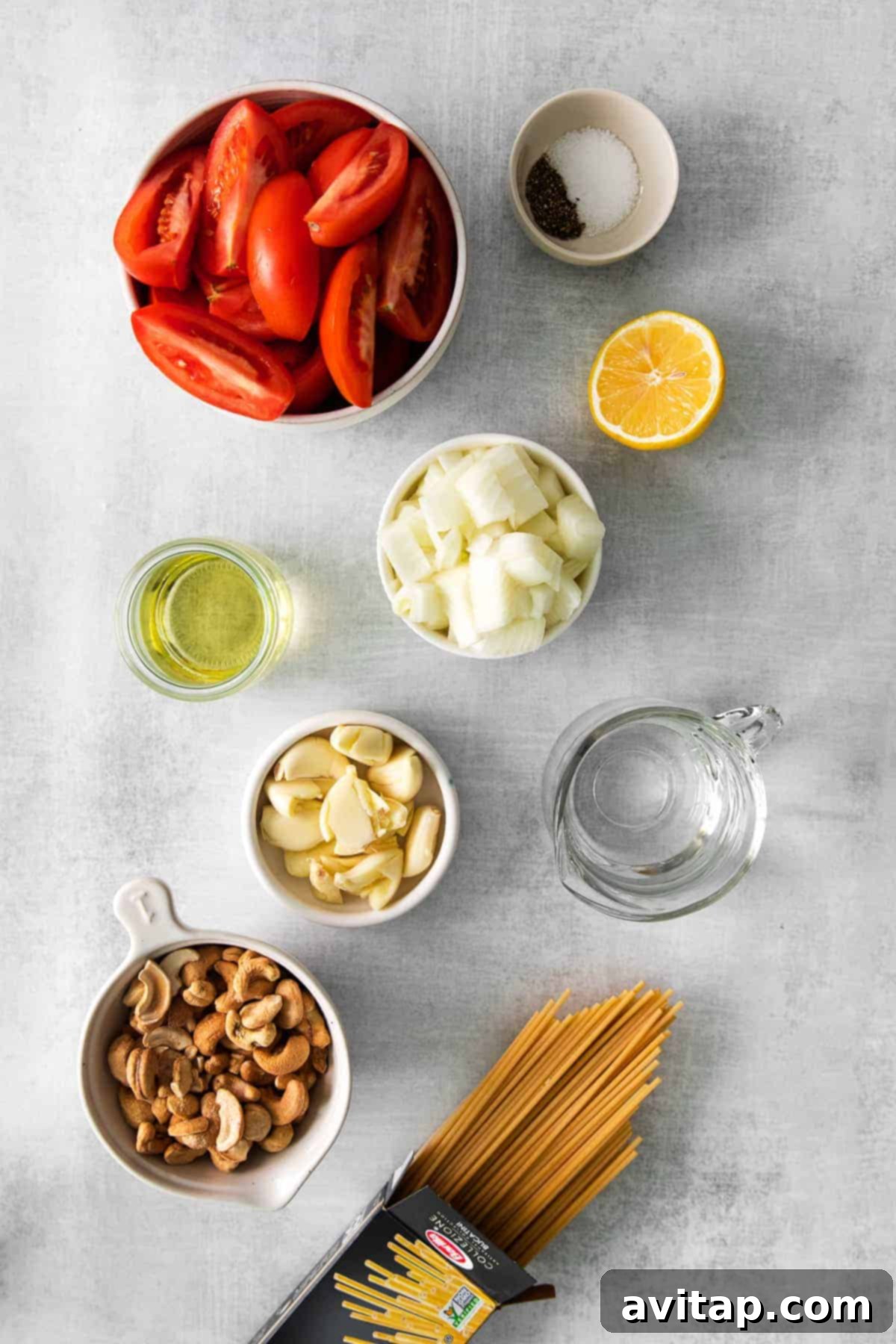 fresh ingredients laid out on a kitchen counter for making vegan pasta