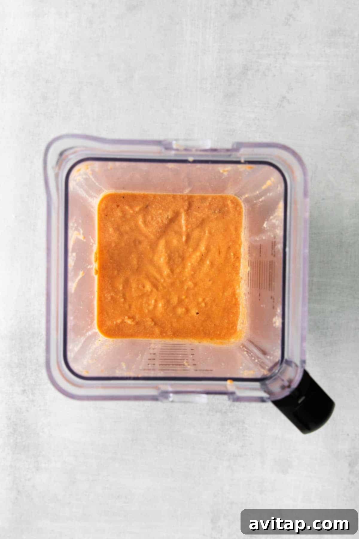 creamy vegan pasta sauce in a blender ready to be poured over noodles