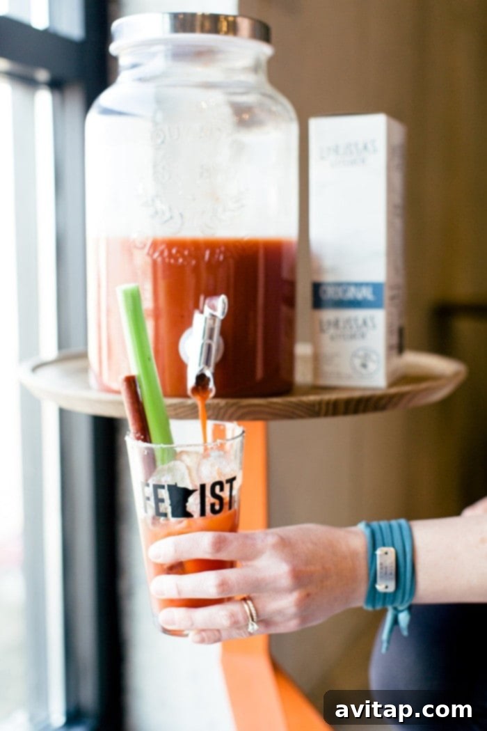 A refreshing Bloody Mary being poured into a glass, symbolizing the celebration of overcoming challenges at the Bloodys and Bouldering event.