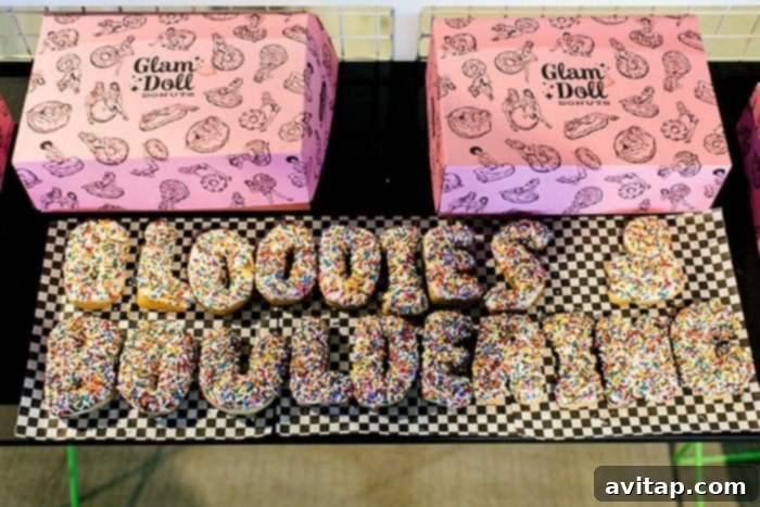 Custom Glam Doll Donuts arranged to spell 'Bloodys + Bouldering,' adding a sweet touch to the community event.