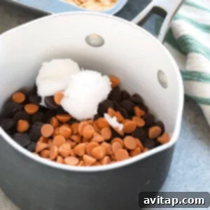 a pan with melted chocolate, butterscotch, and coconut oil for the scotcheroos topping.
