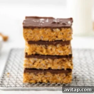 Stacked scotcheroos on a plate, showcasing their perfect layers and delicious appeal.