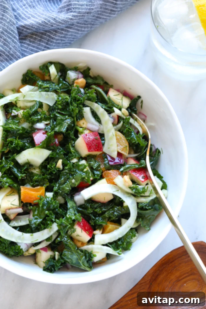 This Massaged Fennel and Kale Salad with Lemon Vinaigrette is a perfect side dish for any dinner this week. It is a delicious combination of sweet and savory! Feel free to serve it by itself or with protein! Finished kale salad in a serving bowl.