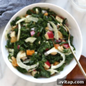 Lemon-Zested Massaged Kale & Fennel Salad 2 a bowl of kale salad with apples.