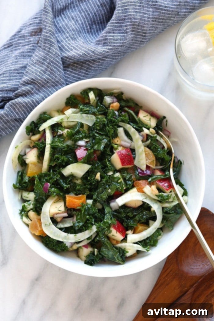 This massaged kale and fennel salad is dressed with an easy lemon vinegarette that is packed with flavor and ready in less than 15 minutes. Meal-prep this salad for the family this week if you need a quick and easy weeknight meal. Finished massage kale salad in a mixing bowl.