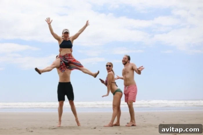 Person jumping joyfully on the secluded Playa Coyote beach in Guanacaste