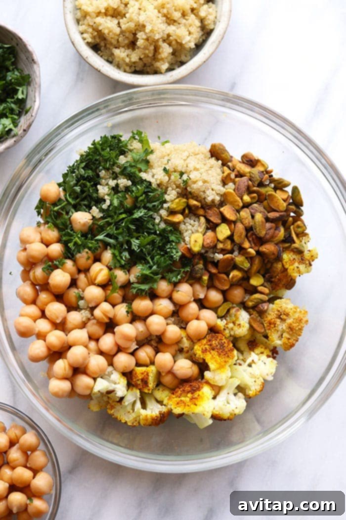A large mixing bowl filled with fresh salad ingredients, vibrant and colorful.