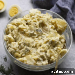 Instant Pot Potato Salad in a bowl, ready to be served. Healthy, gluten-free, and quick to make.