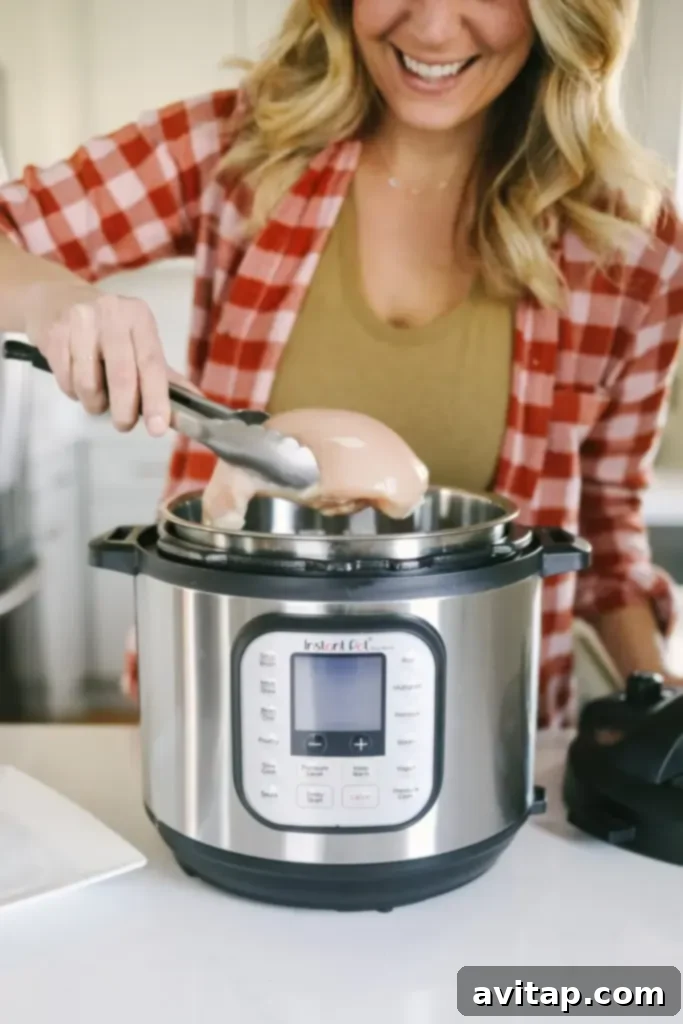 Variety of spices and seasonings displayed next to an Instant Pot, illustrating the endless flavor possibilities for shredded chicken.