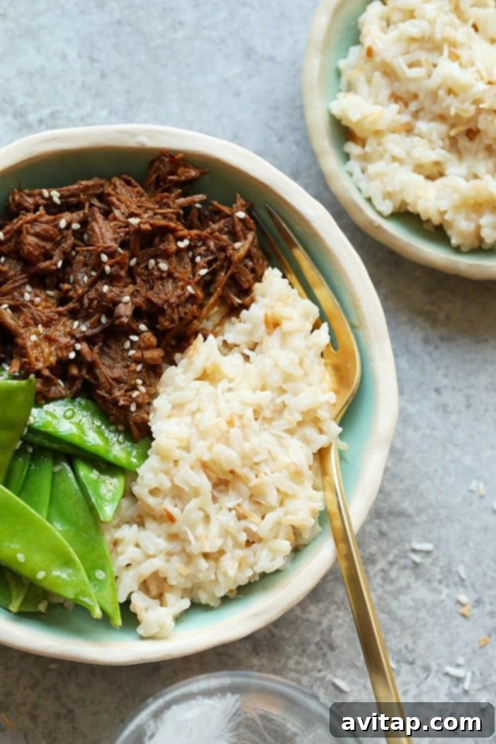 Perfectly Sweetened, Creamy Instant Pot Coconut Rice Creamy Instant Pot Coconut Rice, a perfectly sweetened and fluffy side dish, served in a bowl