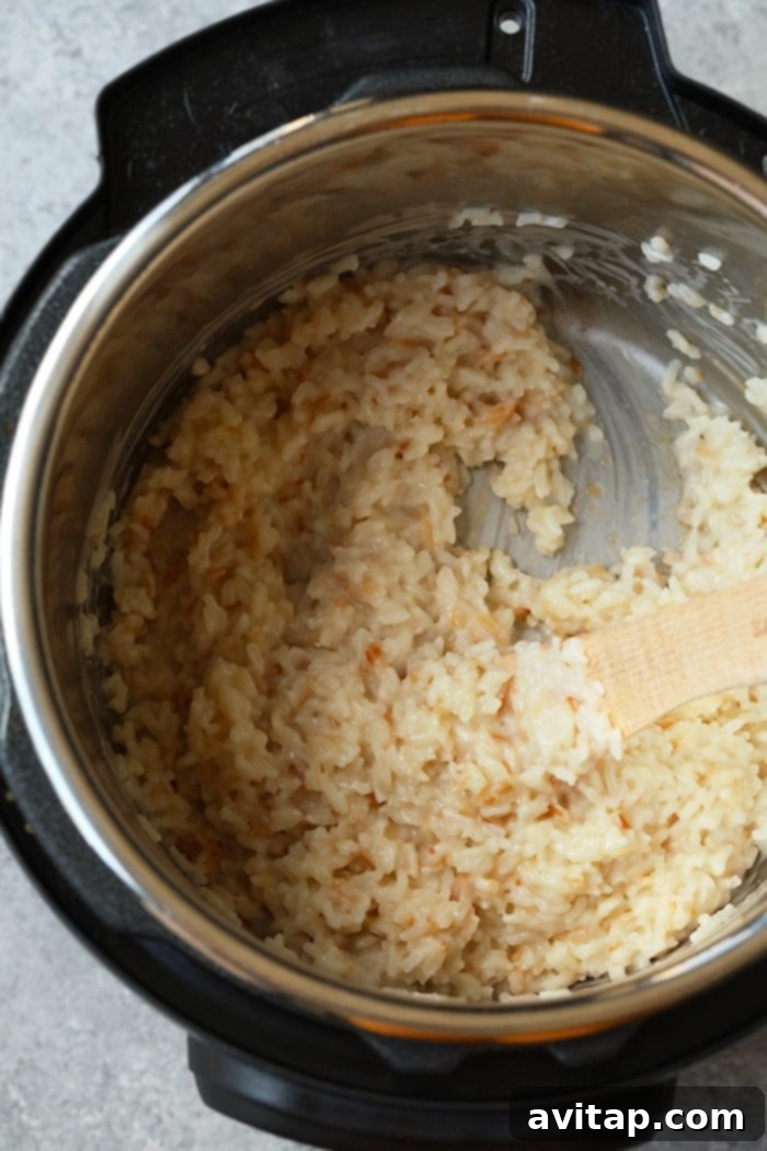 Simple Ingredients for Perfect Coconut Rice Simple ingredients for Instant Pot Coconut Rice laid out: long-grain white rice, can of full-fat coconut milk, water, and honey.