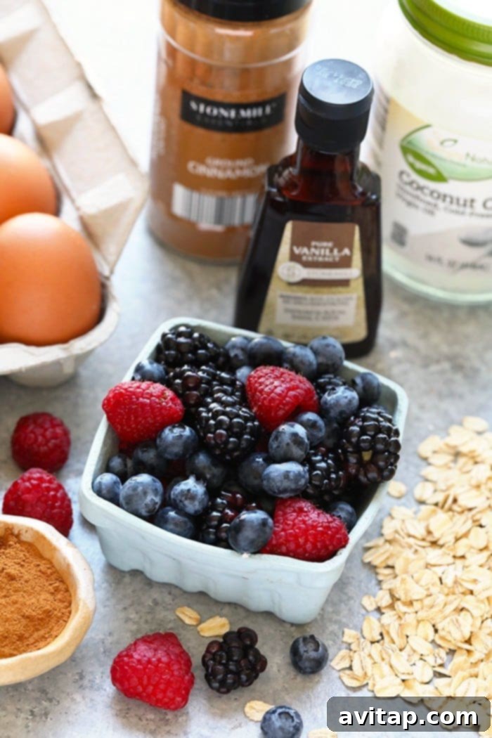 Key Ingredients for Delicious Triple Berry Baked Oatmeal Cups Fresh ingredients for Triple Berry Baked Oatmeal Cups laid out on a table