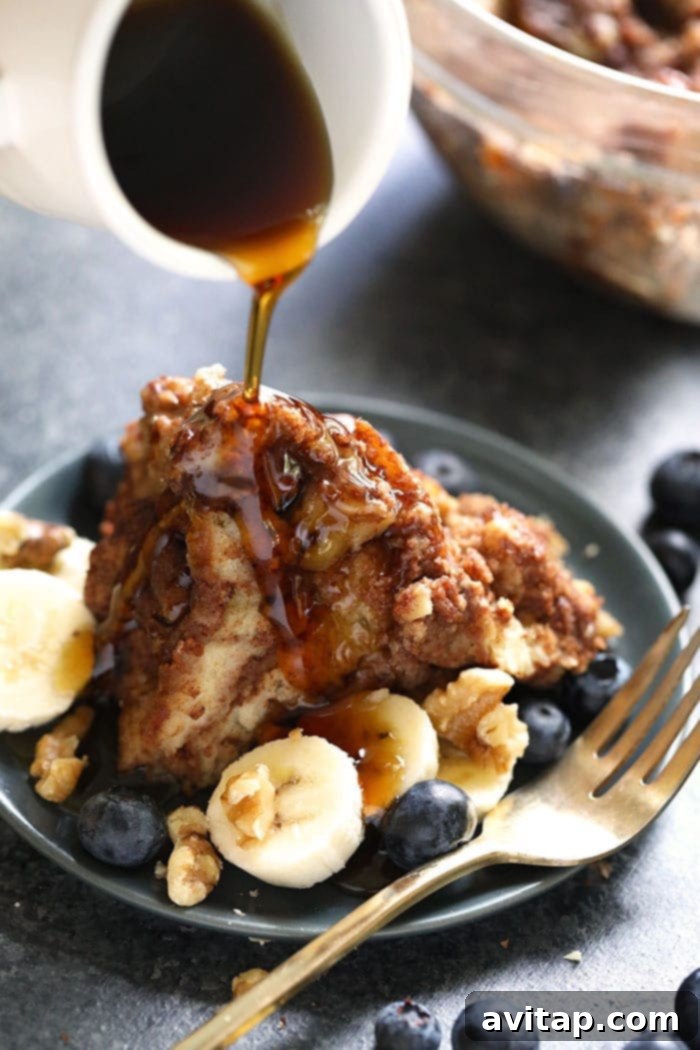 Golden Instant Pot French Toast Casserole generously drizzled with rich maple syrup, ready to serve.