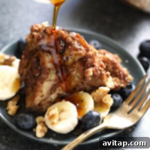French toast with bananas and blueberries on a plate.