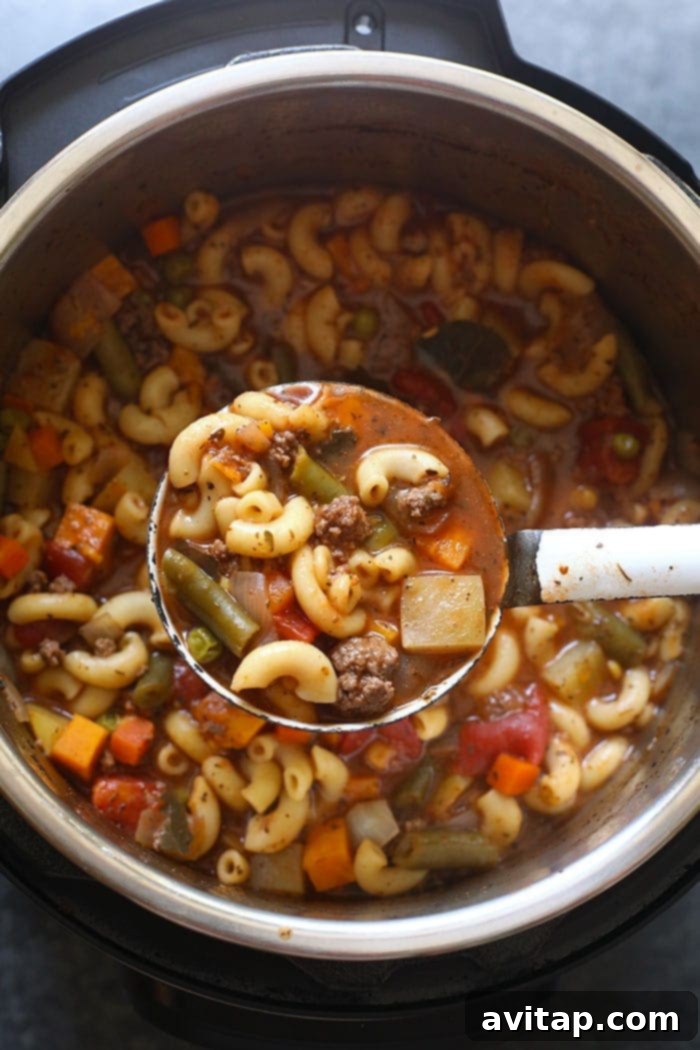 Finished Instant Pot Hamburger Soup steaming gently in the Instant Pot, ready to be served.