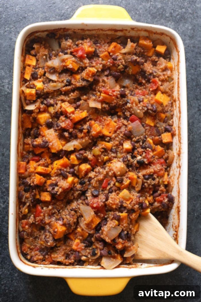 Hearty portion of Mexican Quinoa Sweet Potato Casserole with fresh toppings.
