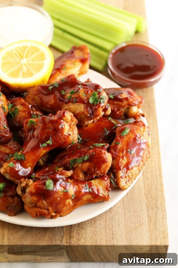 plate of chicken wings with bbq sauce