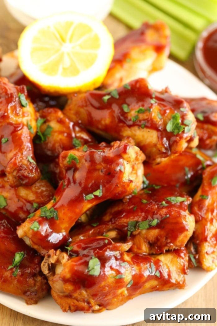 bbq wings on a plate with lemon
