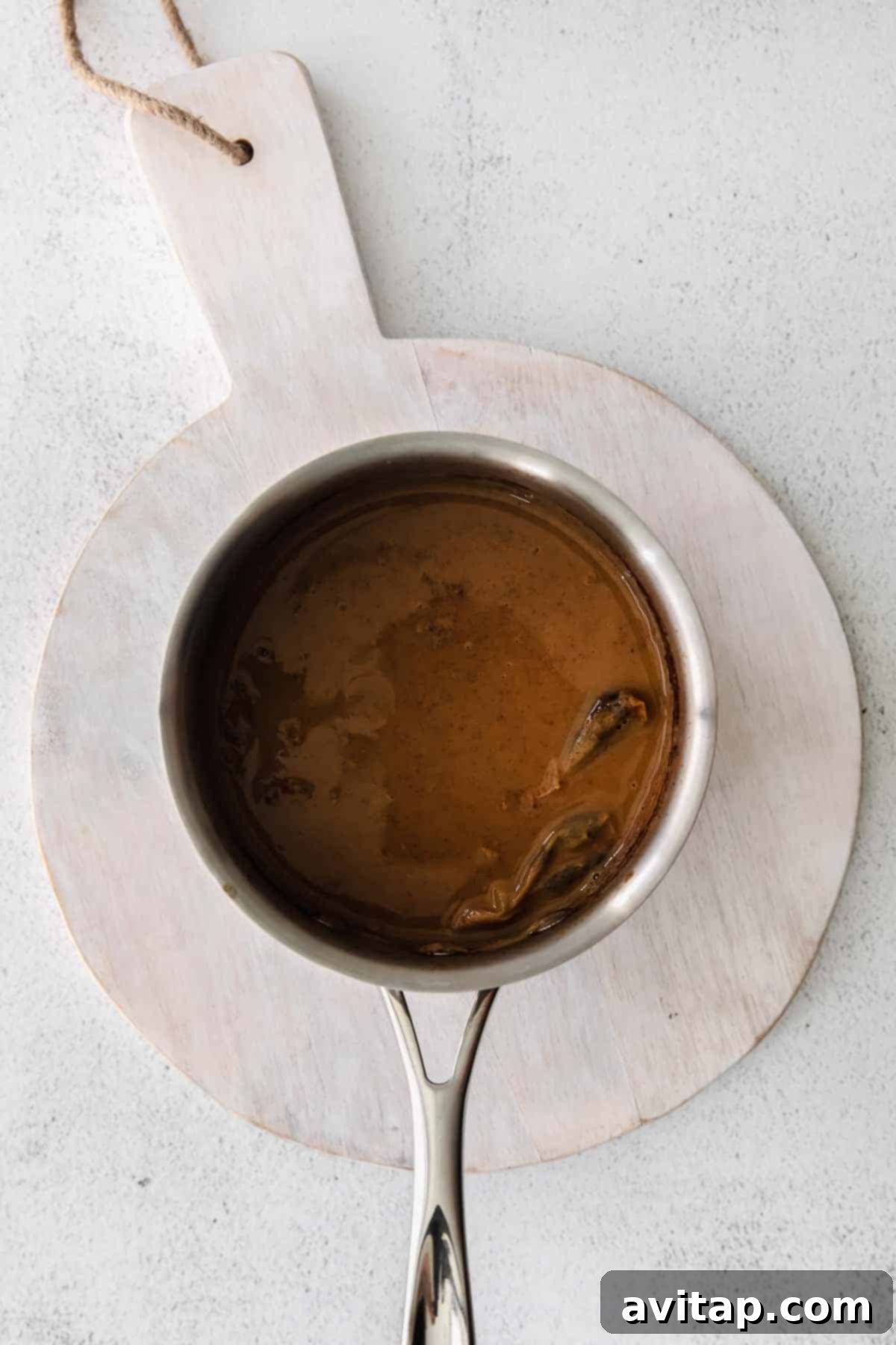 Ingredients for homemade chai tea latte laid out on a kitchen counter