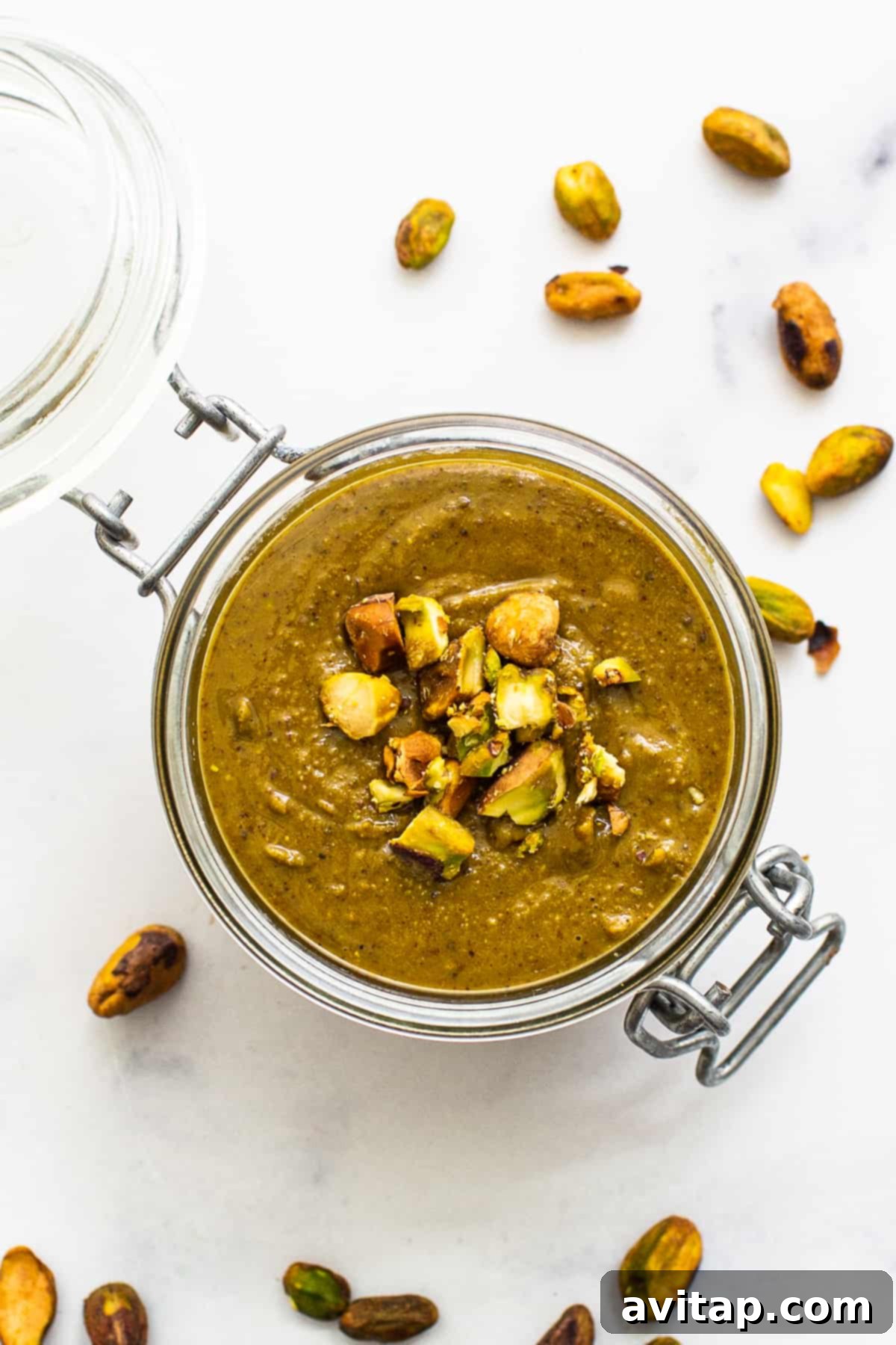 Homemade pistachio butter in a glass dish, ready to be enjoyed.