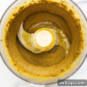 Creamy pistachio butter in a food processor.