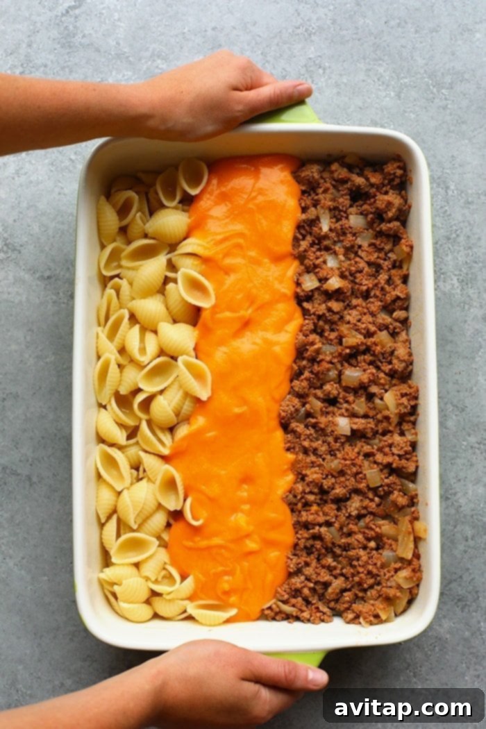 hamburger casserole ingredients in a casserole dish
