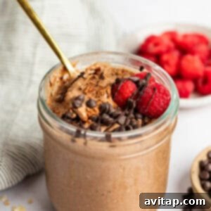 A top-down view of chocolate overnight oats in a jar, showcasing the rich texture before toppings.