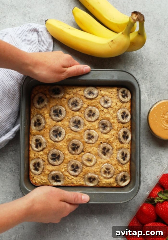 Baked oatmeal queens do we have a recipe for you! This Peanut Butter Banana Baked Oatmeal is perfectly sweetened with mashed banana and a little bit of maple syrup and gluten-free made with ground oat flour and rolled oats. Make this on the weekend for the family or during the week for a healthy breakfast meal prep recipe. Gluten-free peanut butter banana baked oatmeal for healthy breakfast meal prep