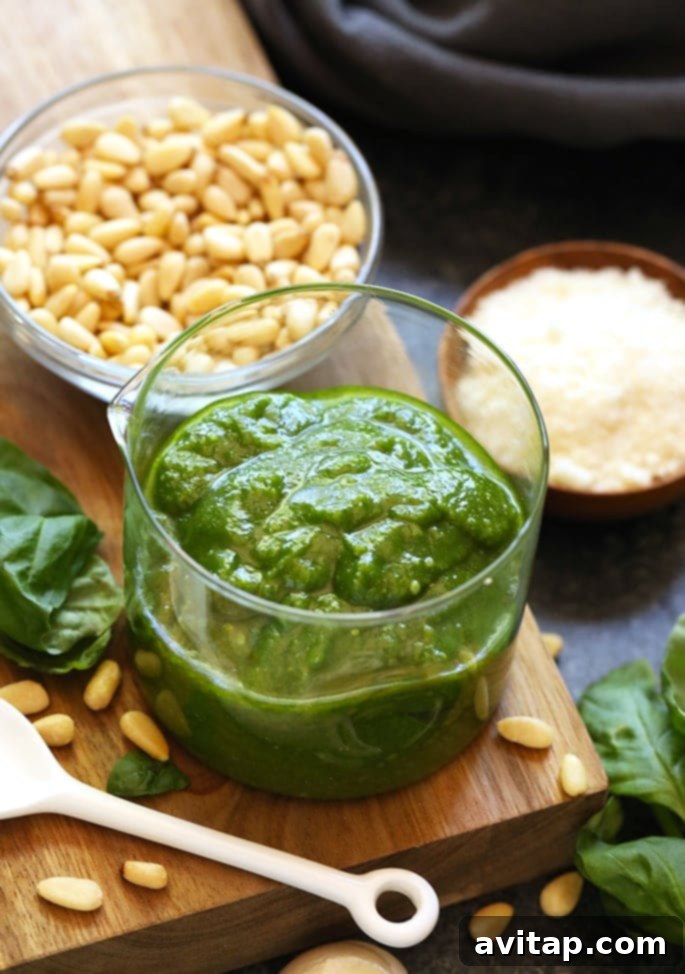 Put all that garden-fresh basil to good use with this healthy homemade pesto recipe that seriously only takes 5 minutes to make. Whip up a batch for your next seasonal dish, or triple a batch and keep in your freezer to have on hand whenever you need it! Making healthy pesto has never been easier. Quick and healthy 5-minute homemade basil pesto recipe