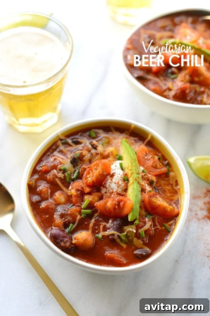 Beer + chili = a match made in heaven! Spice up classic chili and add a bottle of your favorite brew to make this delish Vegetarian Beer Chili! Hearty vegan vegetarian beer chili with rich flavors