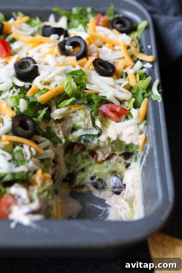 Healthy 7-Layer Greek Yogurt Taco Dip in a serving dish.
