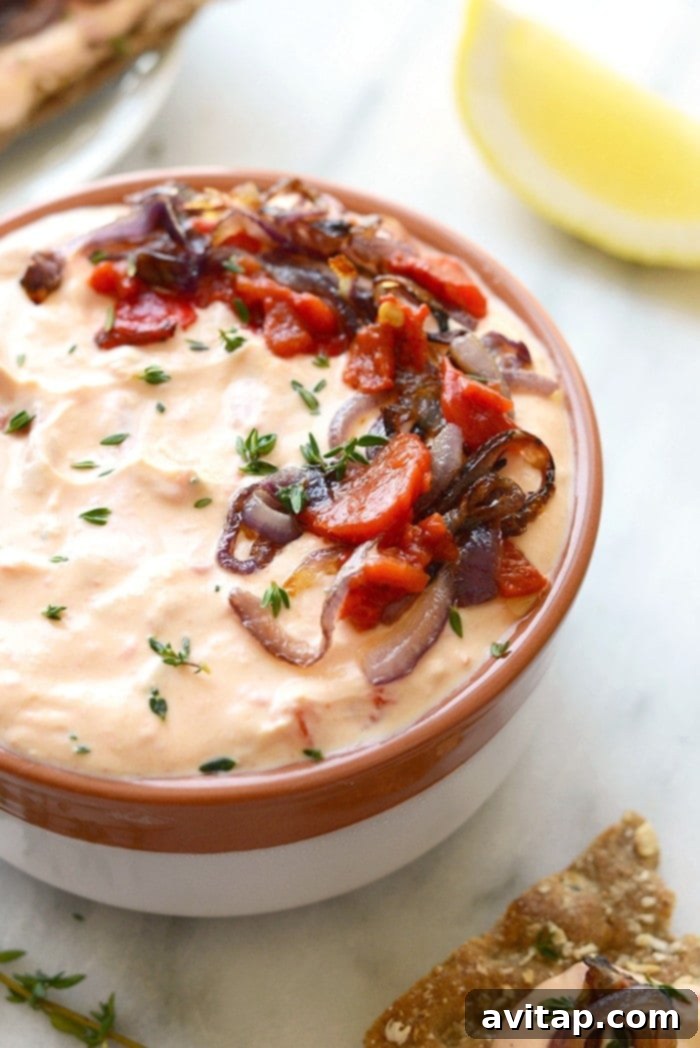 Skinny Roasted Red Pepper and Goat Cheese Dip with veggies.