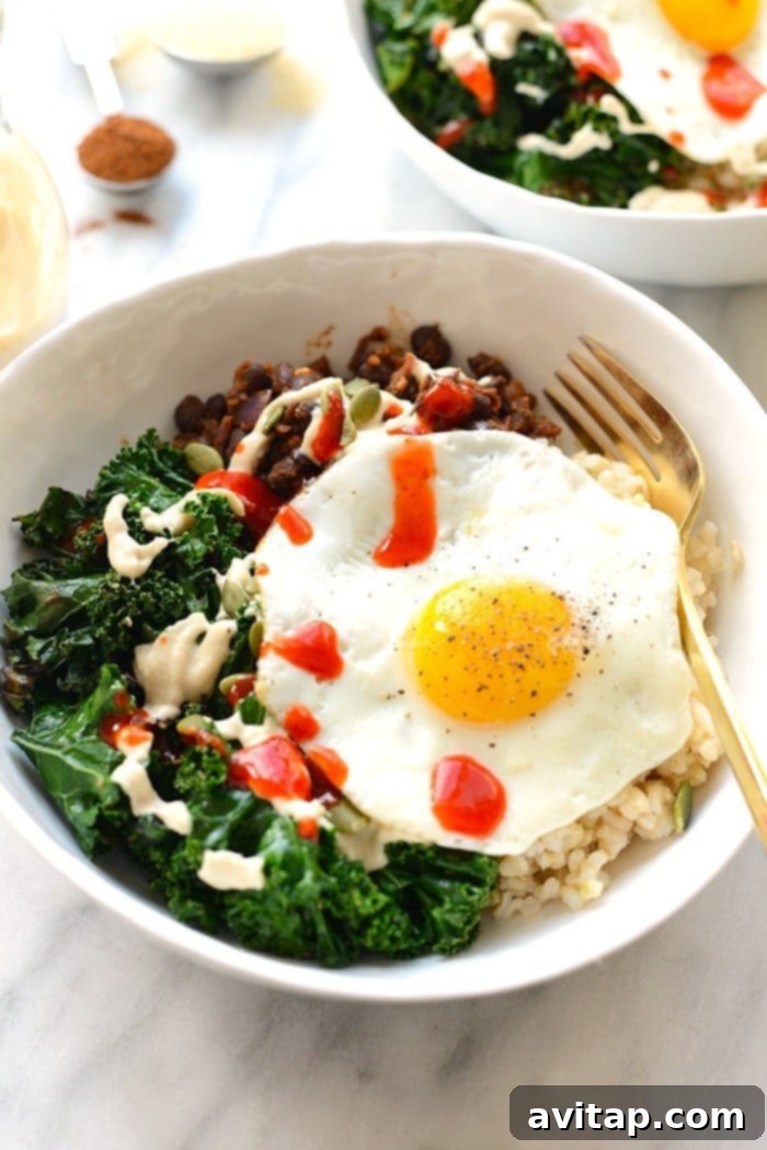 Savory black bean breakfast bowl with kale and an egg.