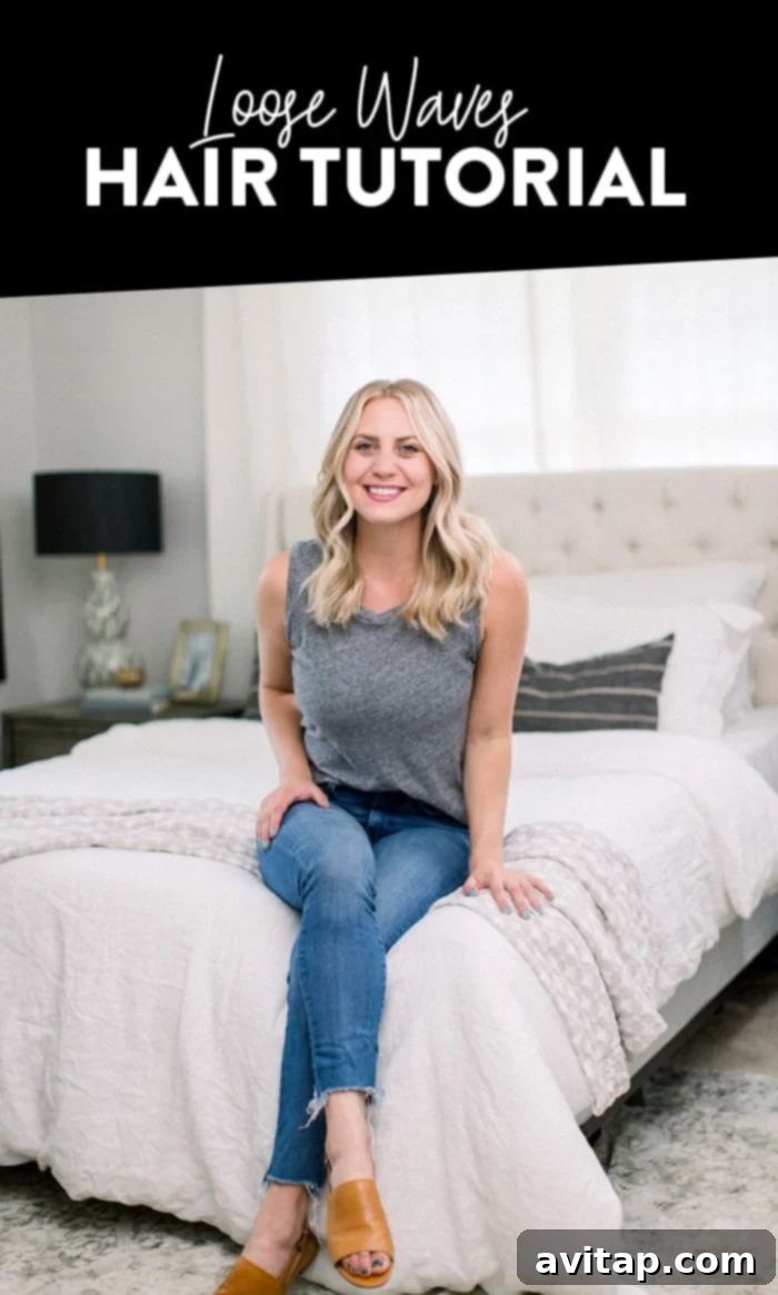 A woman showcasing her perfect loose waves, achieved with a curling iron and minimal products. The image highlights the natural, beachy texture.