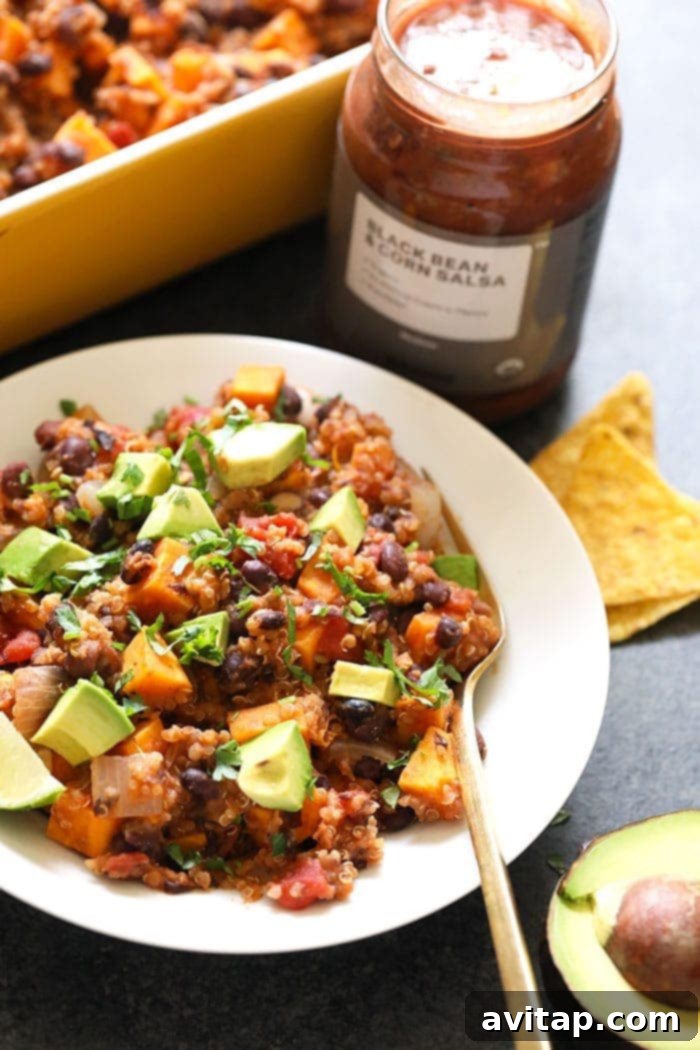 A serving of Mexican Sweet Potato Quinoa Casserole in a bowl, showcasing its rich colors and textures.
