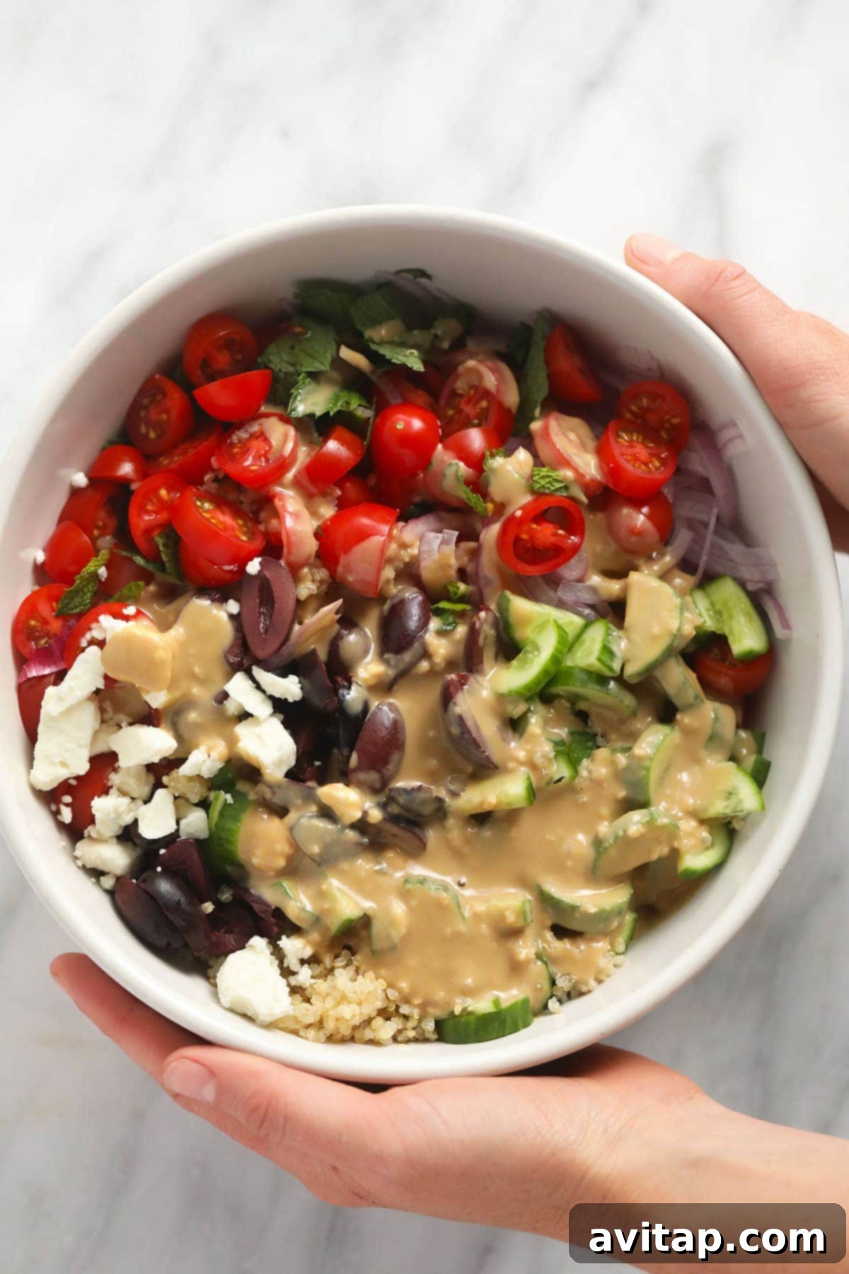 Close-up of a bowl of Mediterranean Quinoa Salad, showcasing its colorful ingredients and appetizing texture.