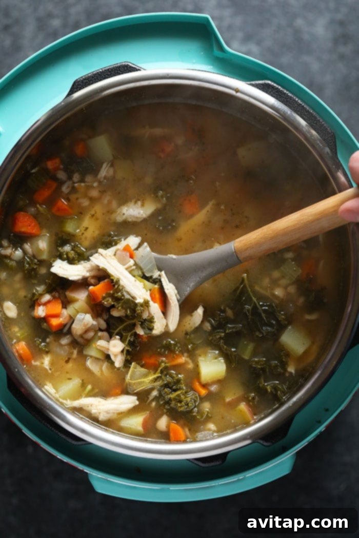 Tuscan Turkey Soup cooking to perfection in the Instant Pot. Delicious Tuscan Turkey Soup simmering in an Instant Pot