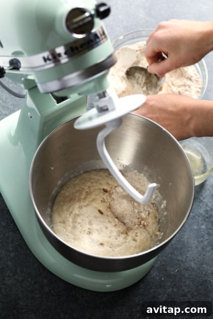Wholesome Homemade Soft Pretzels 4 Yeast, water, and brown sugar mixture foaming in a bowl, indicating active yeast.