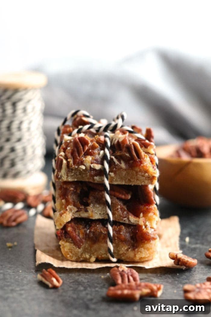 Rustic Stack of Healthy Pecan Pie Bars Stacked healthy pecan pie bars tied with twine, showcasing their rustic charm and delicious layers.