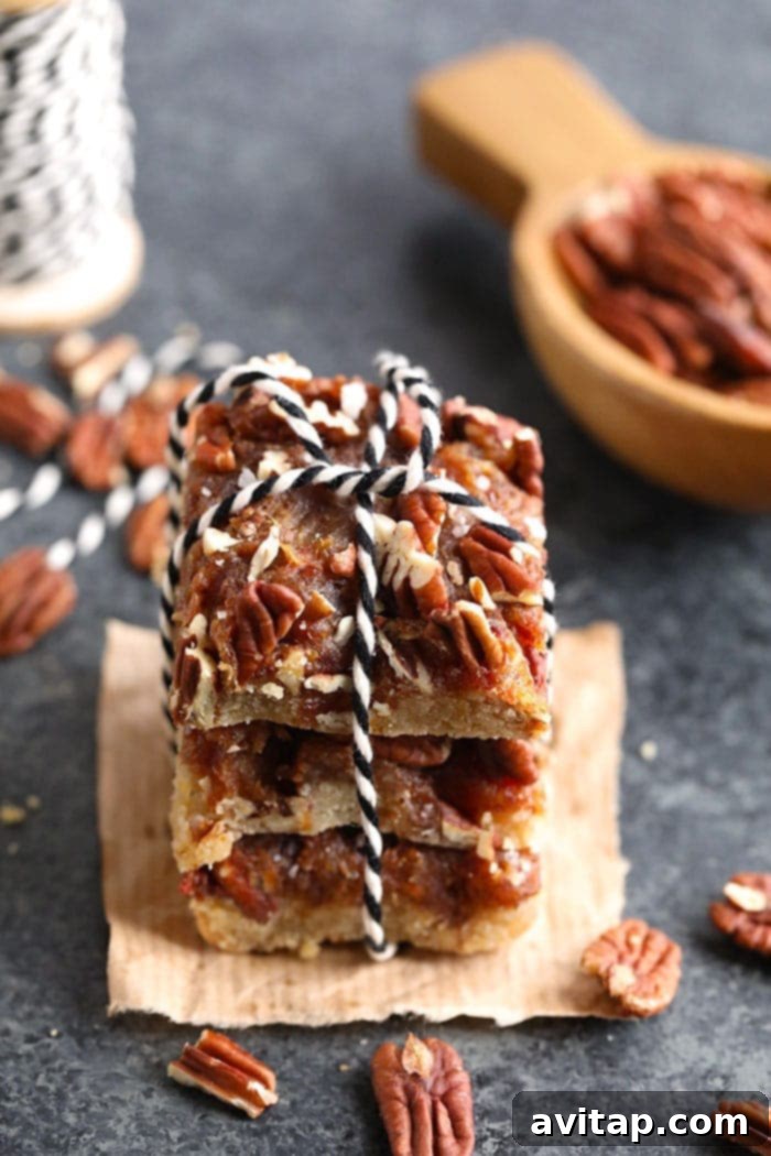 Festive Stack of Easy Pecan Pie Bars with Twine A stack of delightful easy pecan pie bars adorned with twine, symbolizing a perfect homemade gift or festive treat.