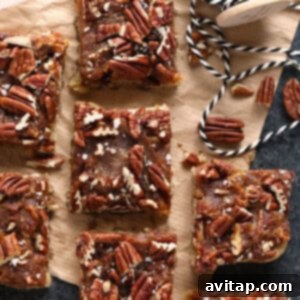 Gooey Pecan Pie Bars 4 Easy pecan bars on a cutting board, ready to be served.