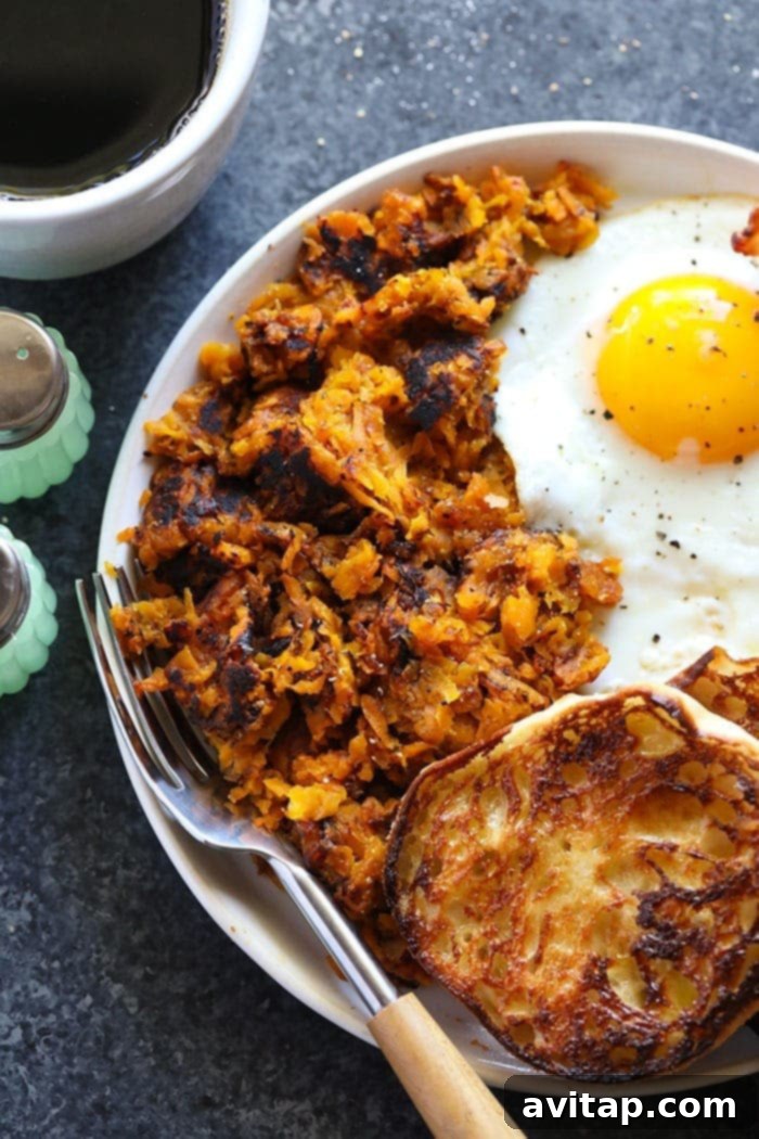Crispy Sweet Potato Hash Browns served on a breakfast plate.