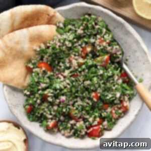 A vibrant bowl of Quinoa Tabouli, showcasing its colorful ingredients and fresh appeal.