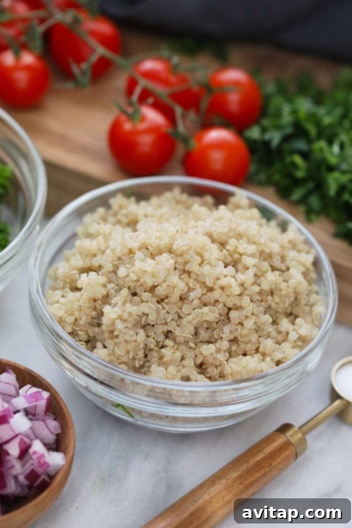 A close-up shot of perfectly cooked quinoa, showcasing its fluffy texture, ready to be transformed into a delicious tabouli.