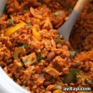 Delicious chicken enchilada casserole in a slow cooker, ready to serve.