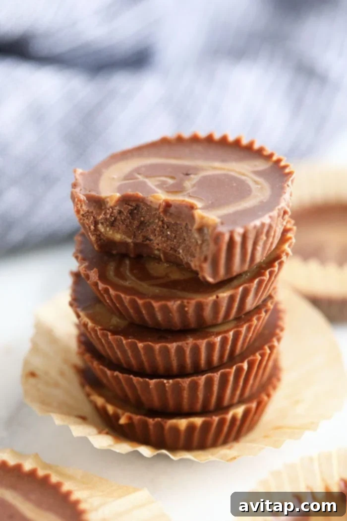 Stacked Chocolate Peanut Butter Fat Bombs, showing their decadent layers.