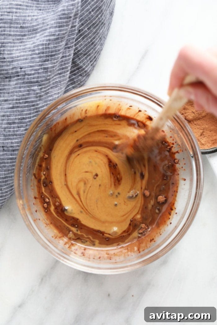 All ingredients for Chocolate Peanut Butter Fat Bombs arranged in a bowl.