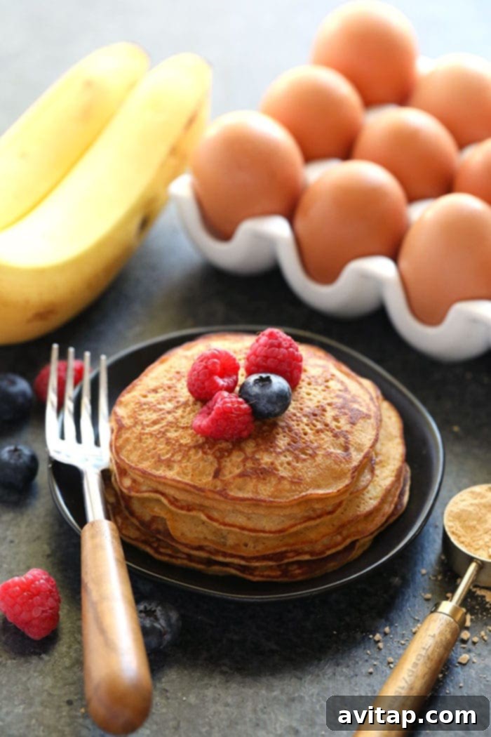 Stacked High-Protein Peanut Flour Pancakes A perfectly stacked tower of high-protein peanut flour pancakes, ready to be enjoyed as a healthy meal.