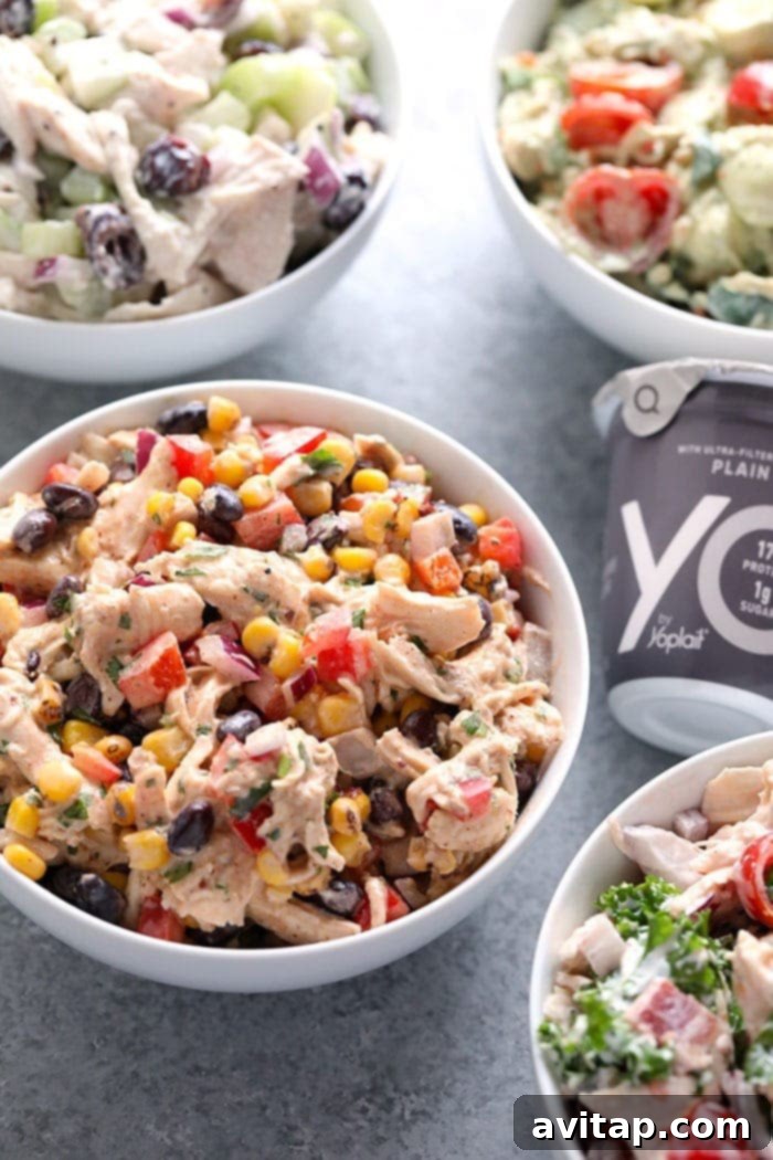 Four Healthy Chicken Salad Recipes 2 Healthy Chicken Salad Recipe with a Greek yogurt base, perfect for meal prep. A vibrant bowl of chicken salad with fresh ingredients.